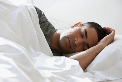 Man asleep on a bed