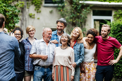 Group of people having their photograph taken.