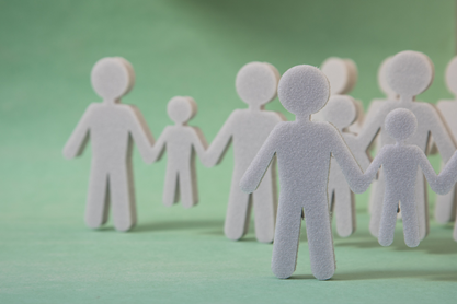 Cut out paper figures of people.